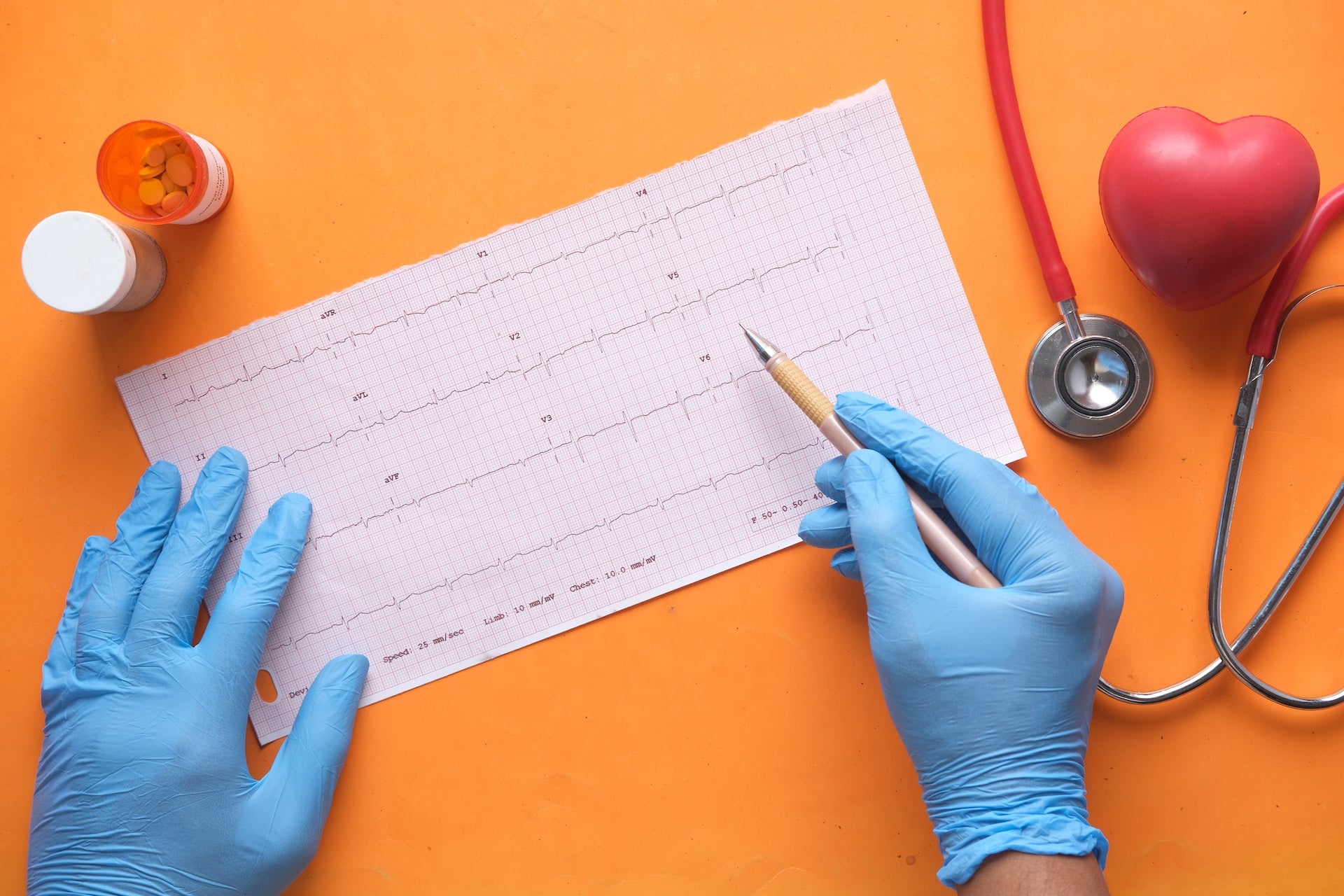 heart health report with pills and stetoscope 